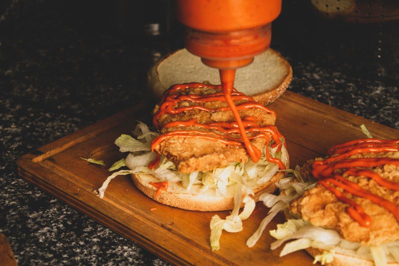 Buffalo chicken burger with hot sauce